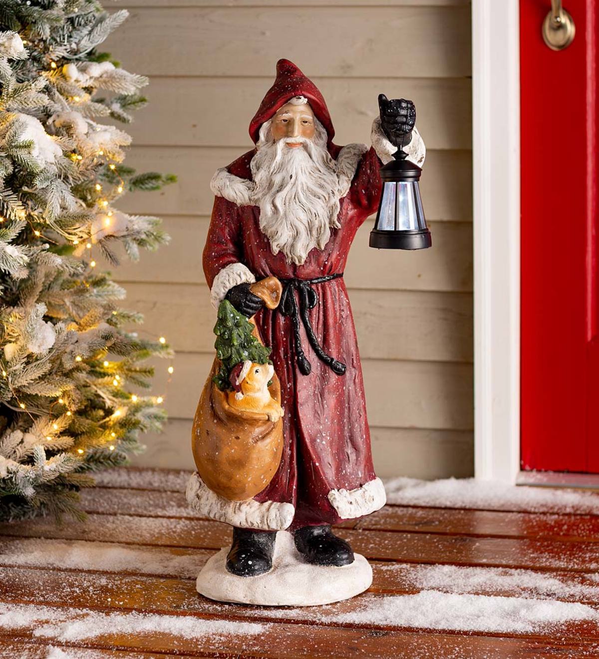 Santa Claus with Solar Lantern and a Puppy In His Bag Decoration