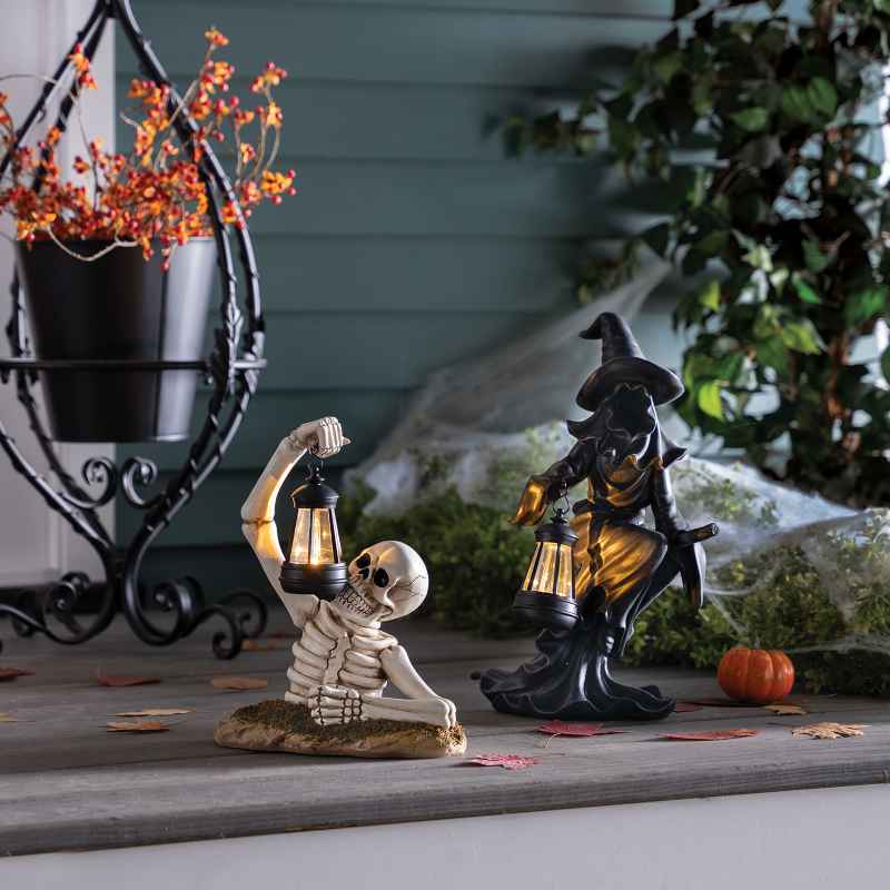 Solar Skeleton Groundbreaker Holding Lantern