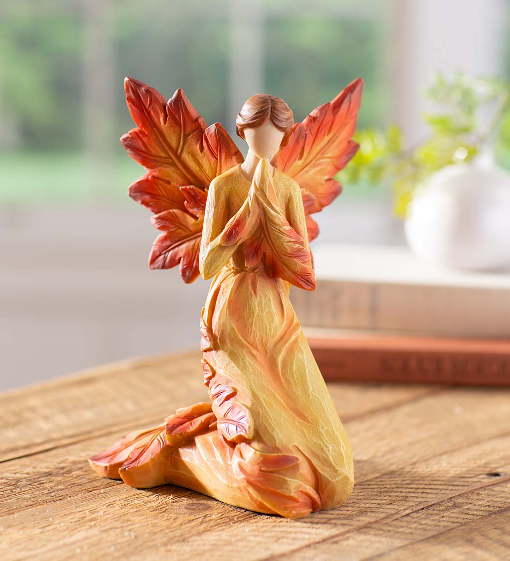 Kneeling Fall Angel with Leaf Wings and Fiery Hues of Autumn