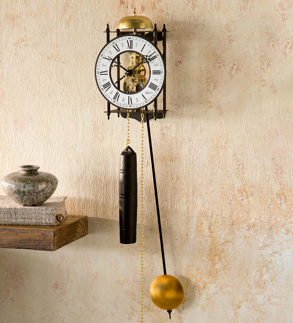 Hermle Brass And Iron Selelton Clock With Bell Strike. 