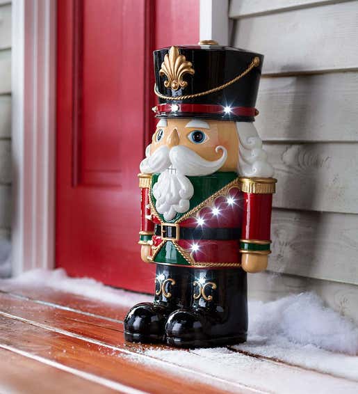 Image of a whimsical lighted nutcracker statue. Shop Outdoor Holiday Decorations